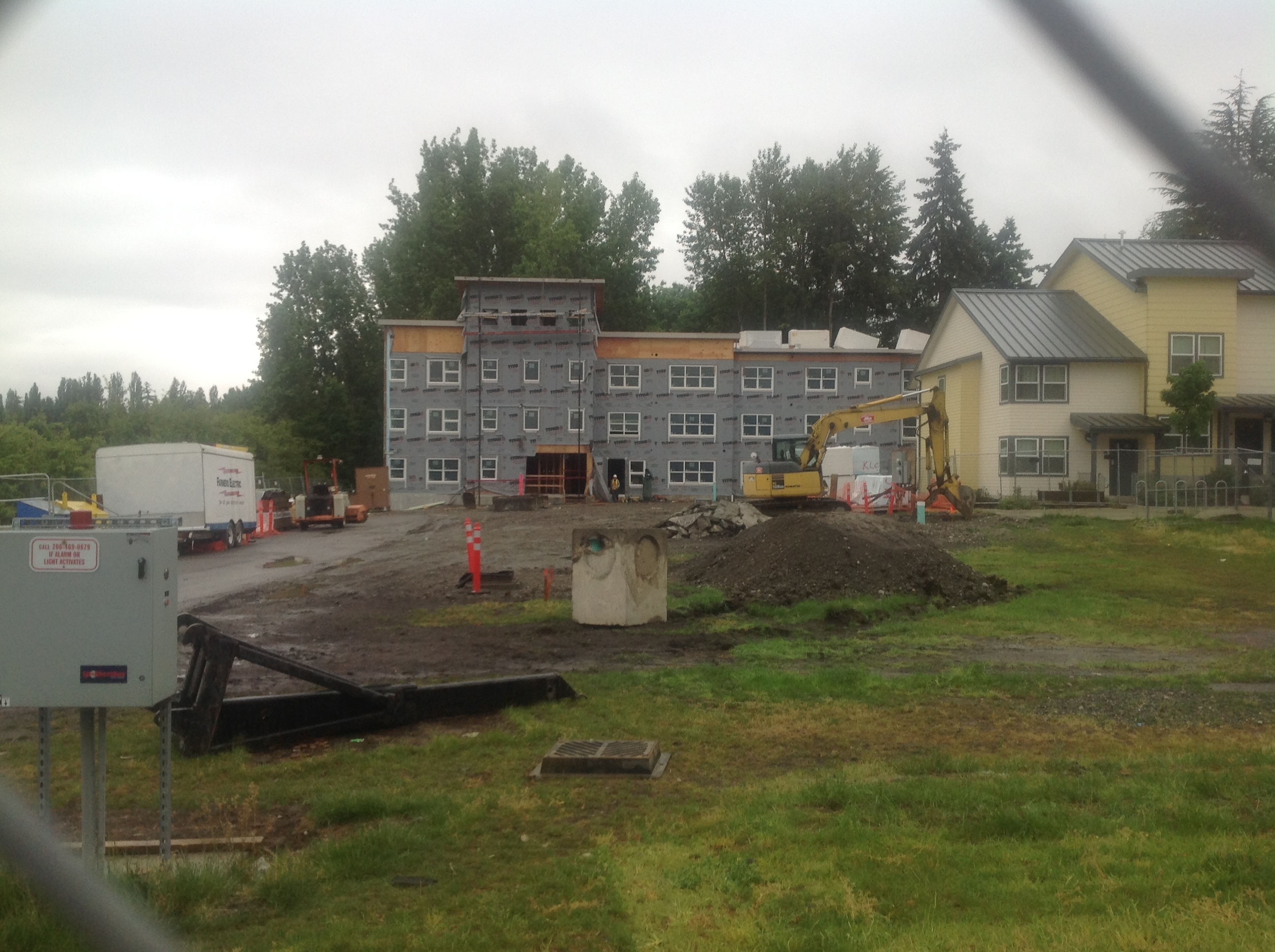Building 4, view from the north; this meadow will eventually be turned into a playground for the 200 children who will live on site.