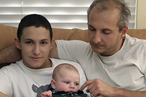 A father & his sons sit together