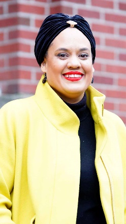 Lhorna poses outside of SPACE (Sand Point Arts & Cultural Exchange), where she recently joined the Board.