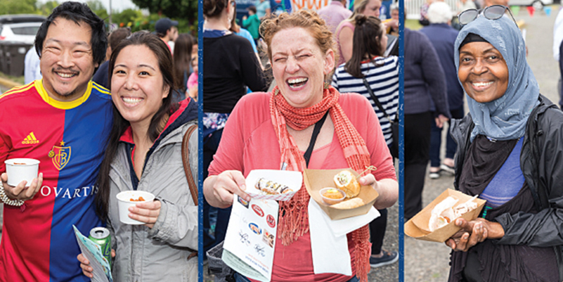 People smiling and holding food 