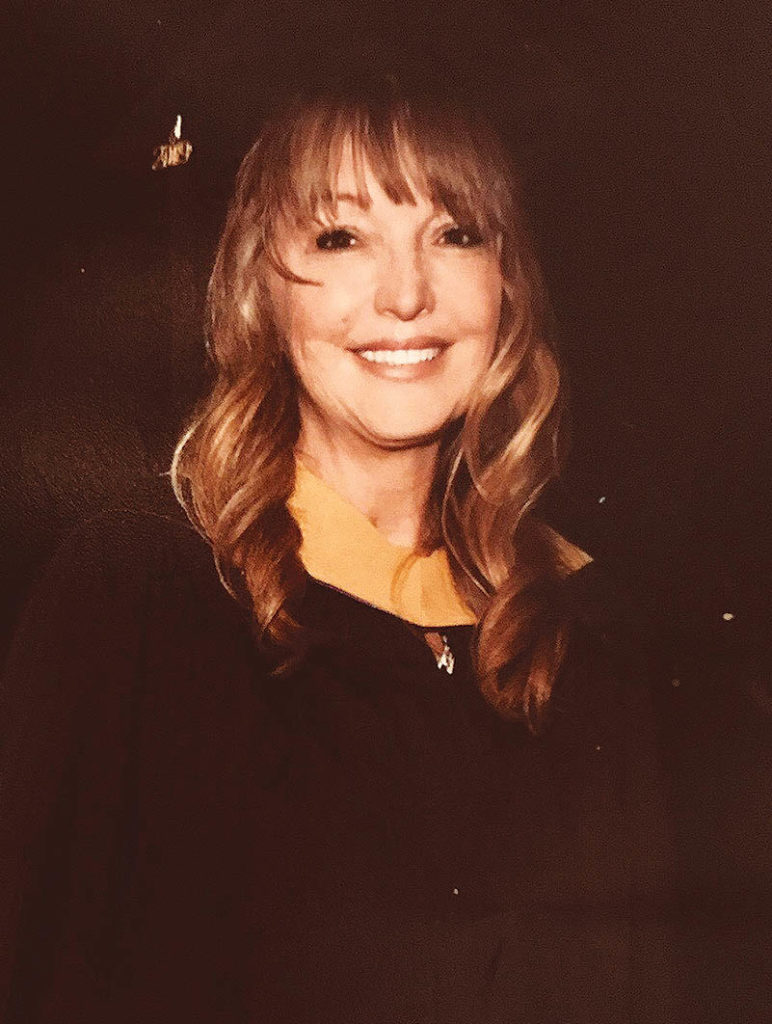 Tracie Warren in cap and gown at her graduation.