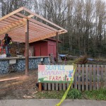 The construction crew secures the canopy boards in place.