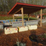 The whimsical background mosaic was created by Youth Arts students from Coyote Central.