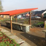While the brick red canopy blends in with the environment, it also adds a touch of warmth and fun.