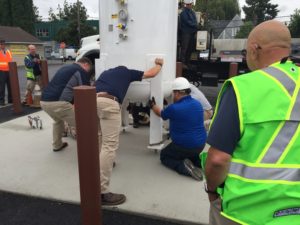 Installing propane tanks at Solid Ground Transportation