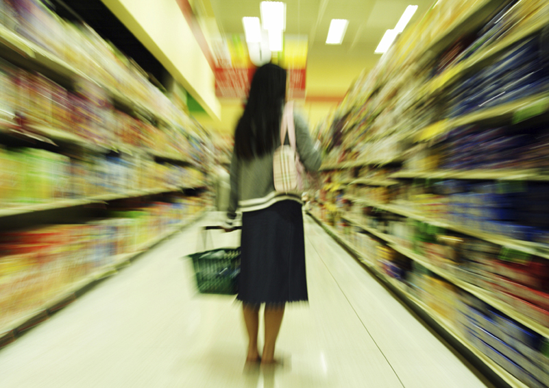 A woman shopping in a grocery store