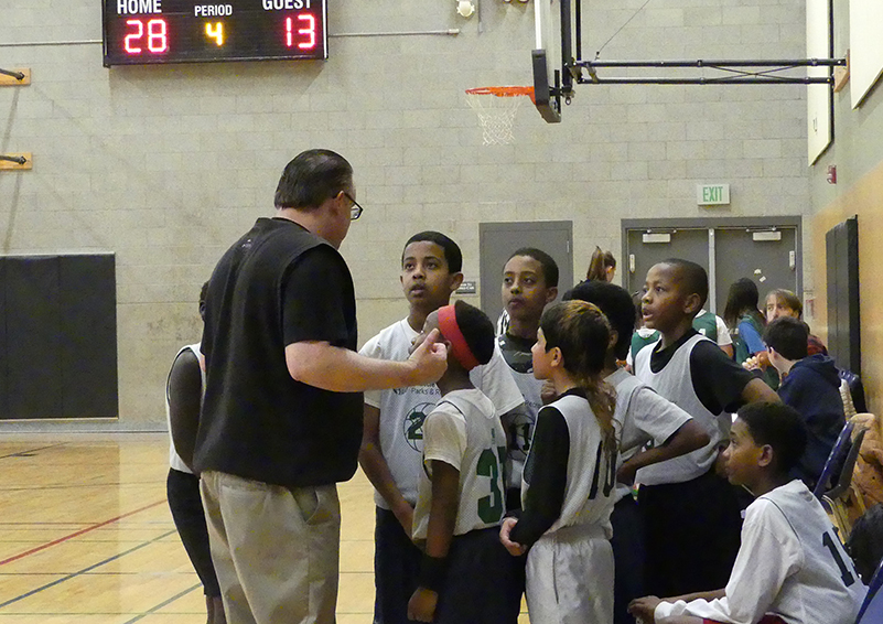 Timeout with a big lead. The players are all focused.