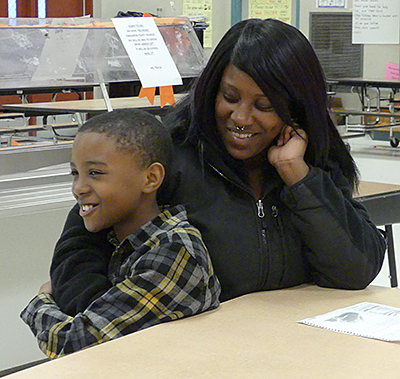 Jamari cuddles with his mom, Angela.