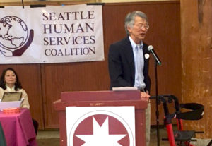 Tony Lee accepting, former Solid Ground Advocacy Director, accepting Lifetime Achievement Award from Seattle Human Services Coalition