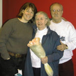 A November 2000 mortgage counseling success: Homeowners Annie & Chris pose with Housing Counselor Kris Beaton after a successful home loan modification.