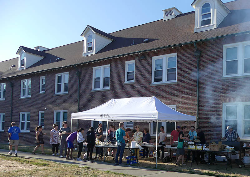 OneLife Community Church BBQ tent, with a line of hungry customers