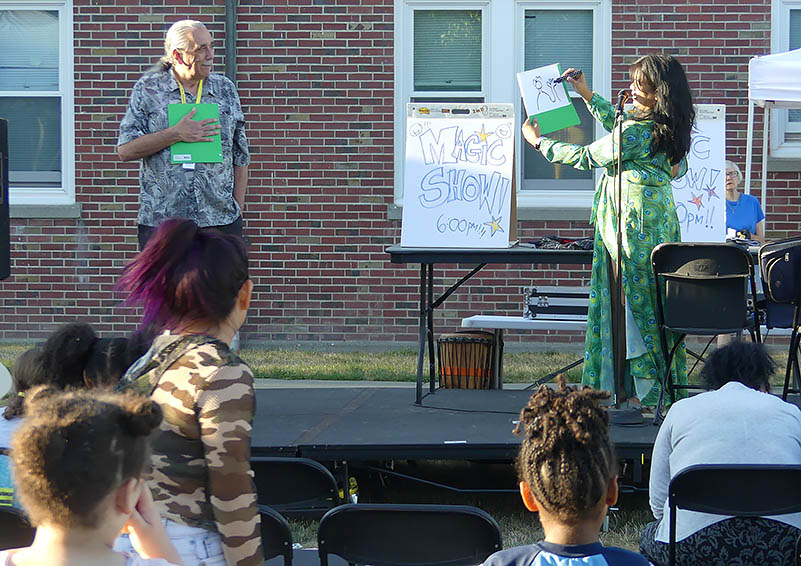 Solid Ground Children's Group Facilitator David Olivera was a willing subject in Seattle Public Library's Magic Show with magician Maritess Zurbano.