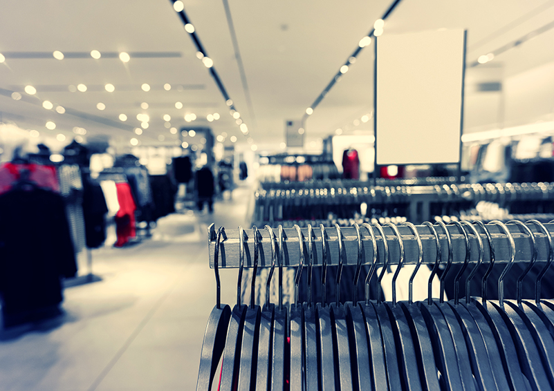 clothes racks and hangers in a department store
