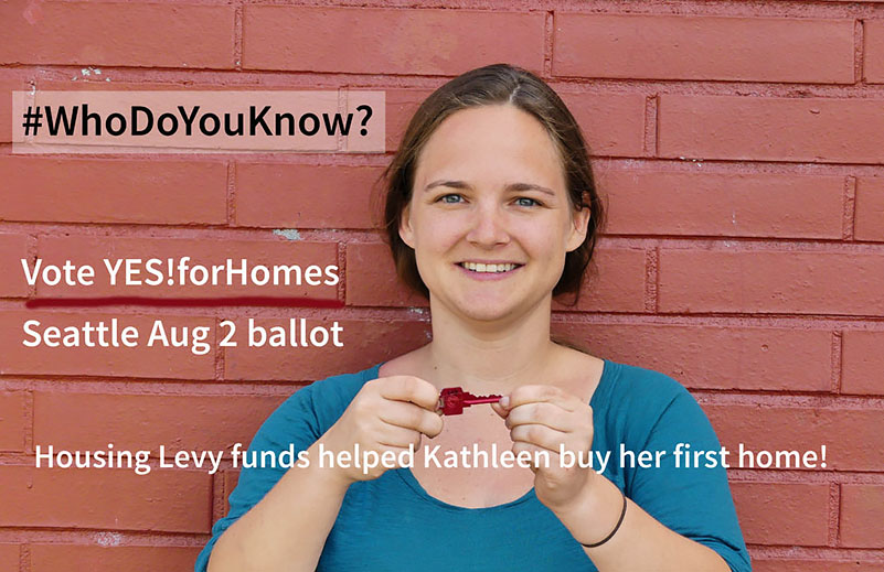 Woman showing off the key to her new home, purchased with the help of the Seattle Housing Levy