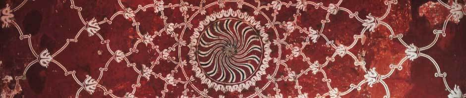 Geometric graphic with a concave circle in the center, white graphic with maroon background