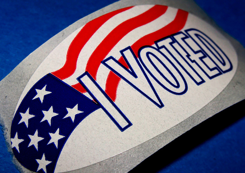 sticker with American flag and the words I Voted