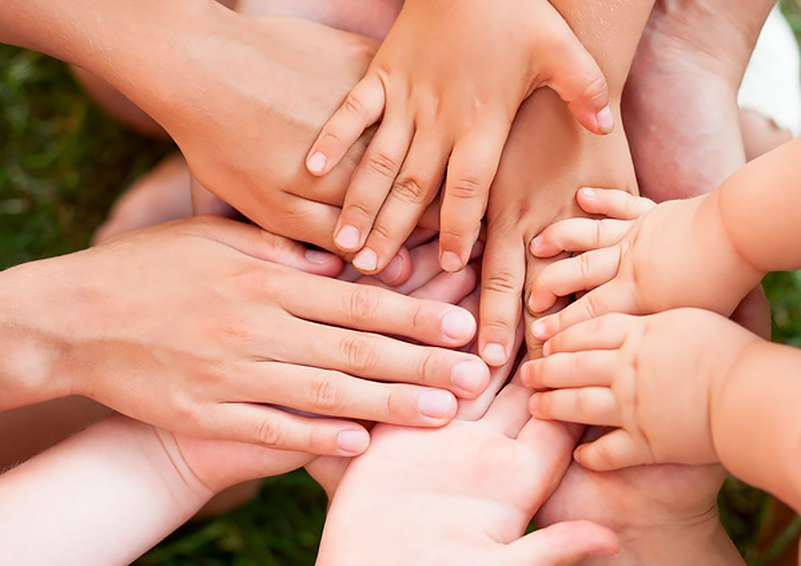 various hands overlapping together