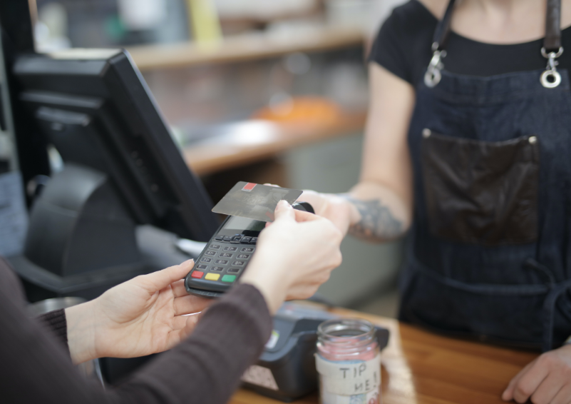 A customer scanning their credit card to make a purchase