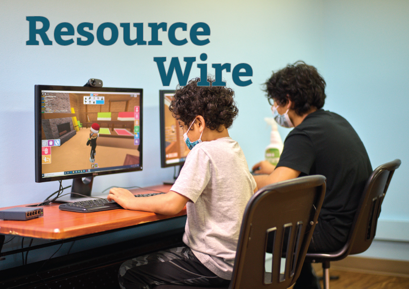 Two boys playing a computers. The words "Resource Wire" appear beside them.