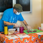 Michael Friedman prepares samples of beet hummus.